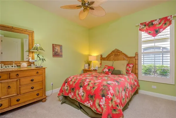 a bed room with a bed and a dresser