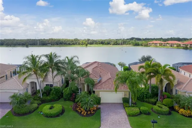 a view of a lake with houses in the back