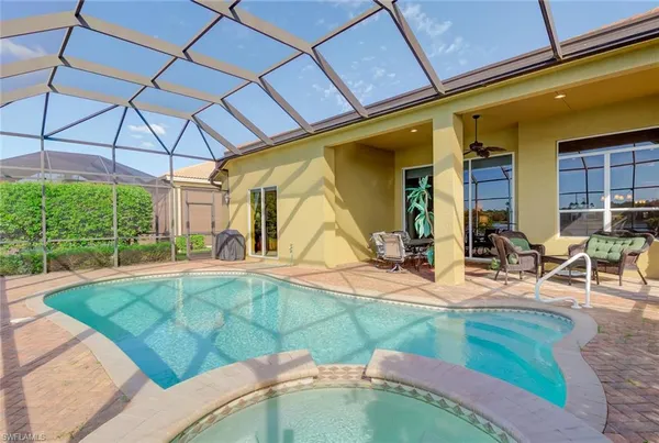 a view of a house with backyard porch and sitting area