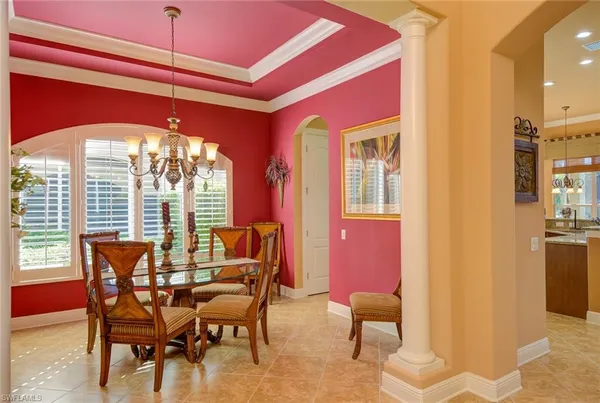 a dining room with furniture and window