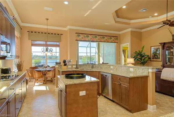 a kitchen with a stove a sink and a refrigerator