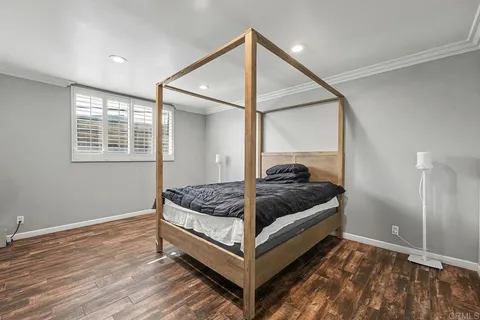 a bedroom with bed and a window