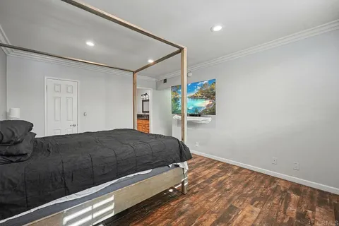 a bedroom with a bed and a dresser