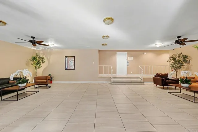 a bedroom with furniture and a potted plant