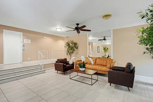 a view of a house with backyard sitting area and swimming pool
