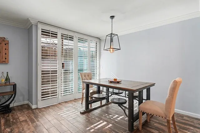 a view of a workspace with furniture window and wooden floor
