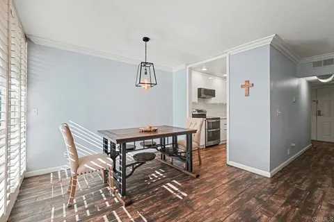 a view of a livingroom with furniture and wooden floor