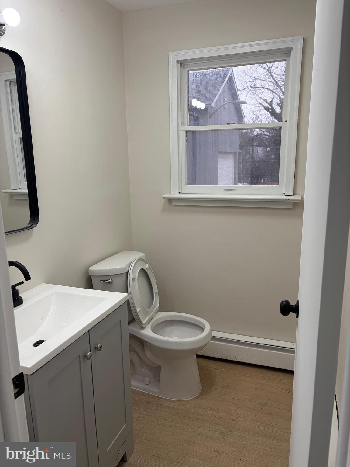 33 Johnson Street Salem, NJ 08079 - Photo 13 of 33 a bathroom with a toilet sink and mirror