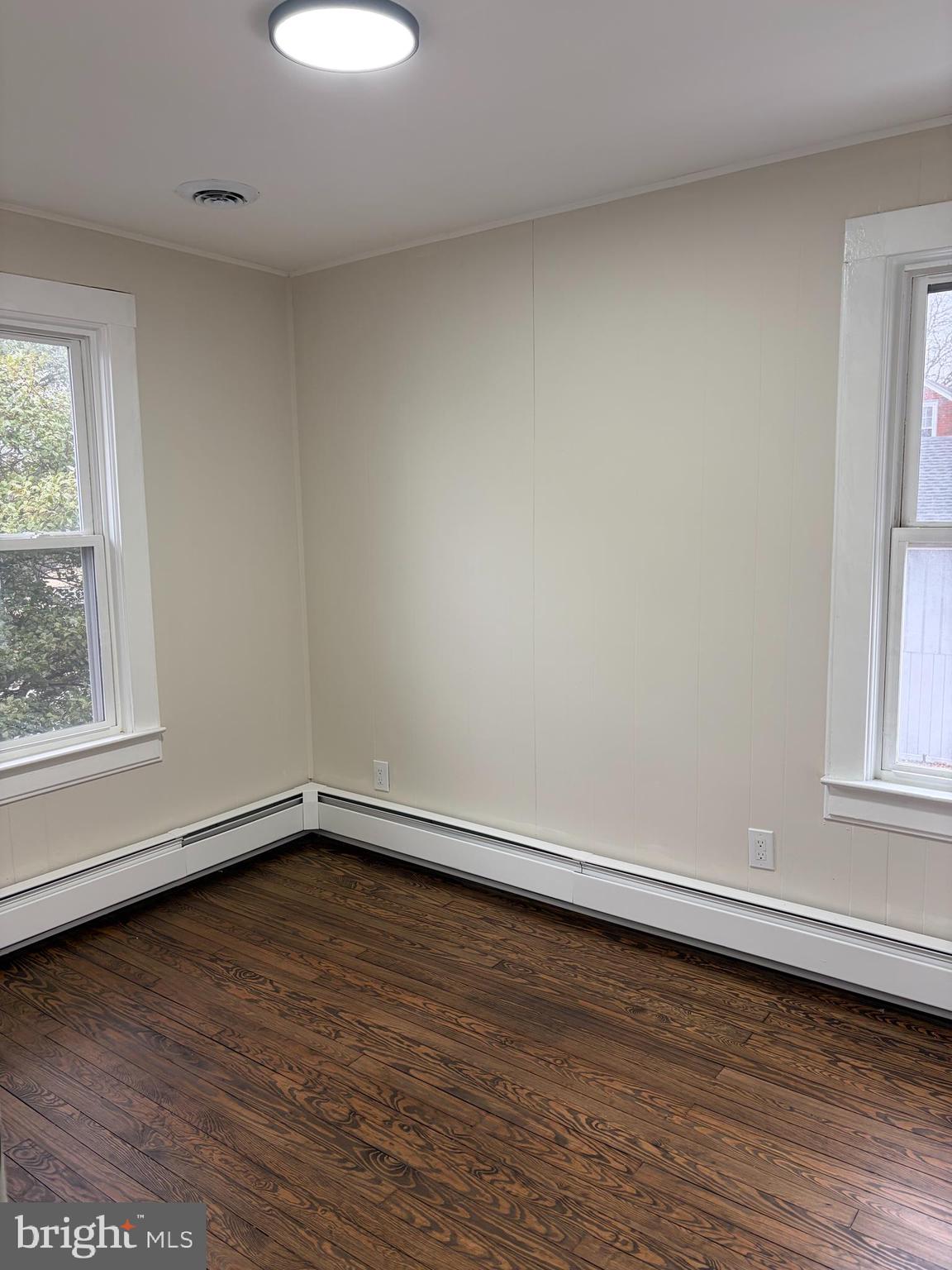 33 Johnson Street Salem, NJ 08079 - Photo 18 of 33 wooden floor in an empty room with a window