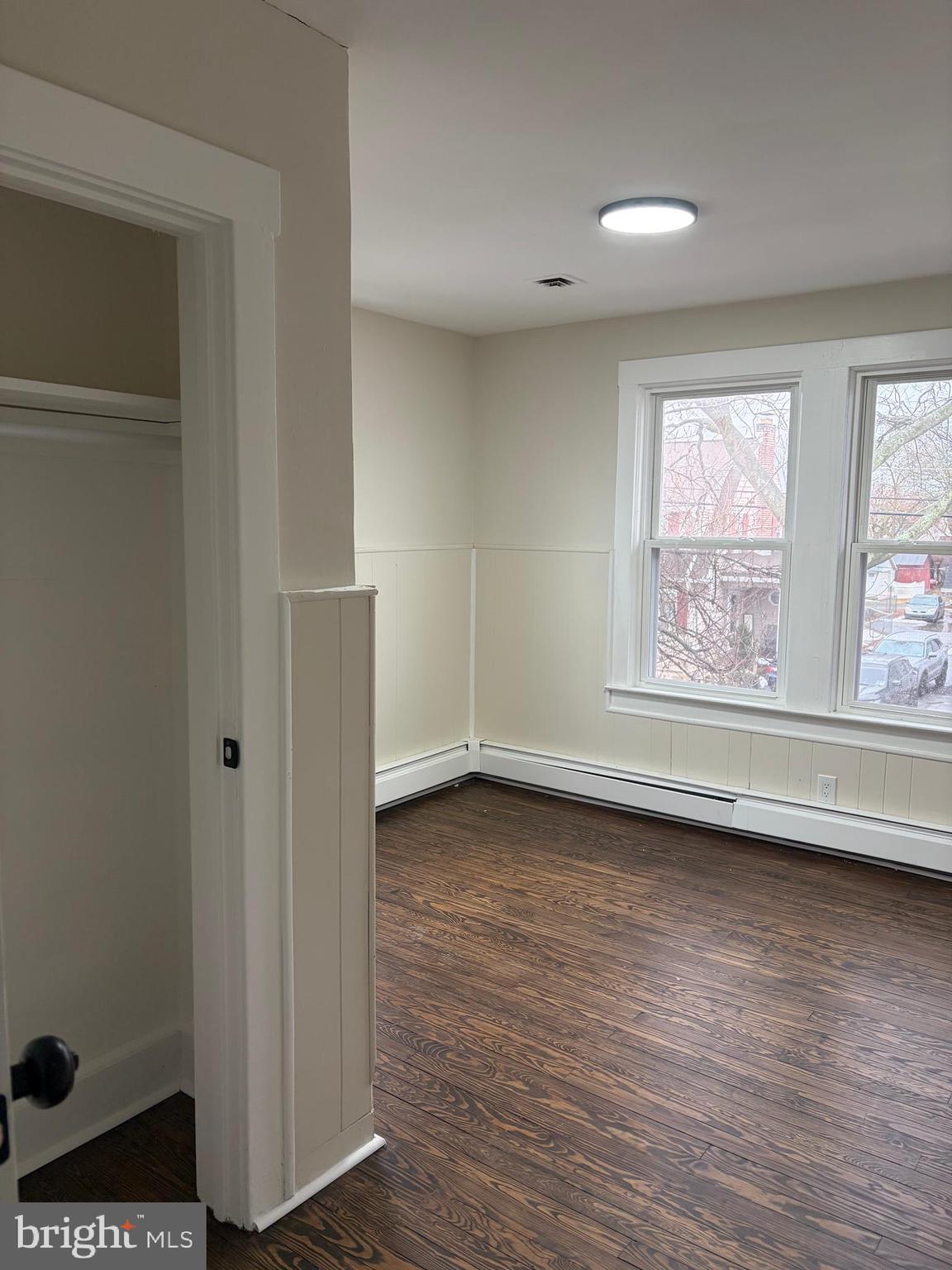 33 Johnson Street Salem, NJ 08079 - Photo 20 of 33 a view of an empty room with a window and wooden floor
