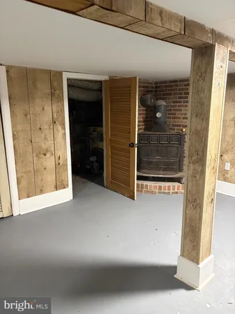 a view of an empty room with a fireplace