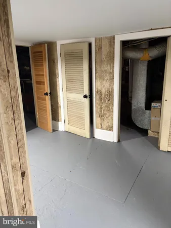 a view of an empty room with a fireplace