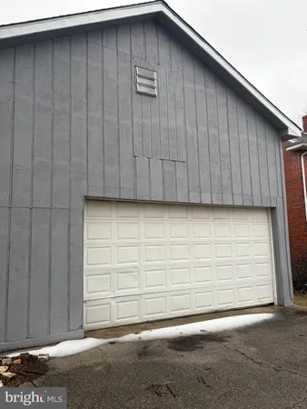 a view of a yard with a large tree