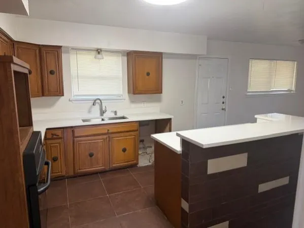 a spacious bathroom with a sink vanity and mirror