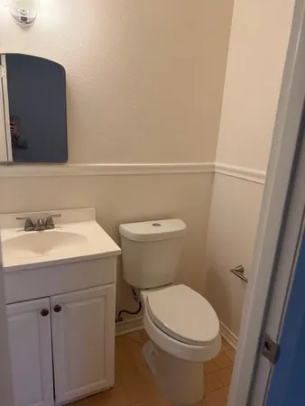 a view of a small space with wooden floor and a window
