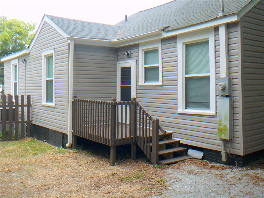 803 East Orr Street Anderson, SC 29621 - Photo 14 of 14 An inviting wooden deck steps down to the backyard from the home's rear entrance.
