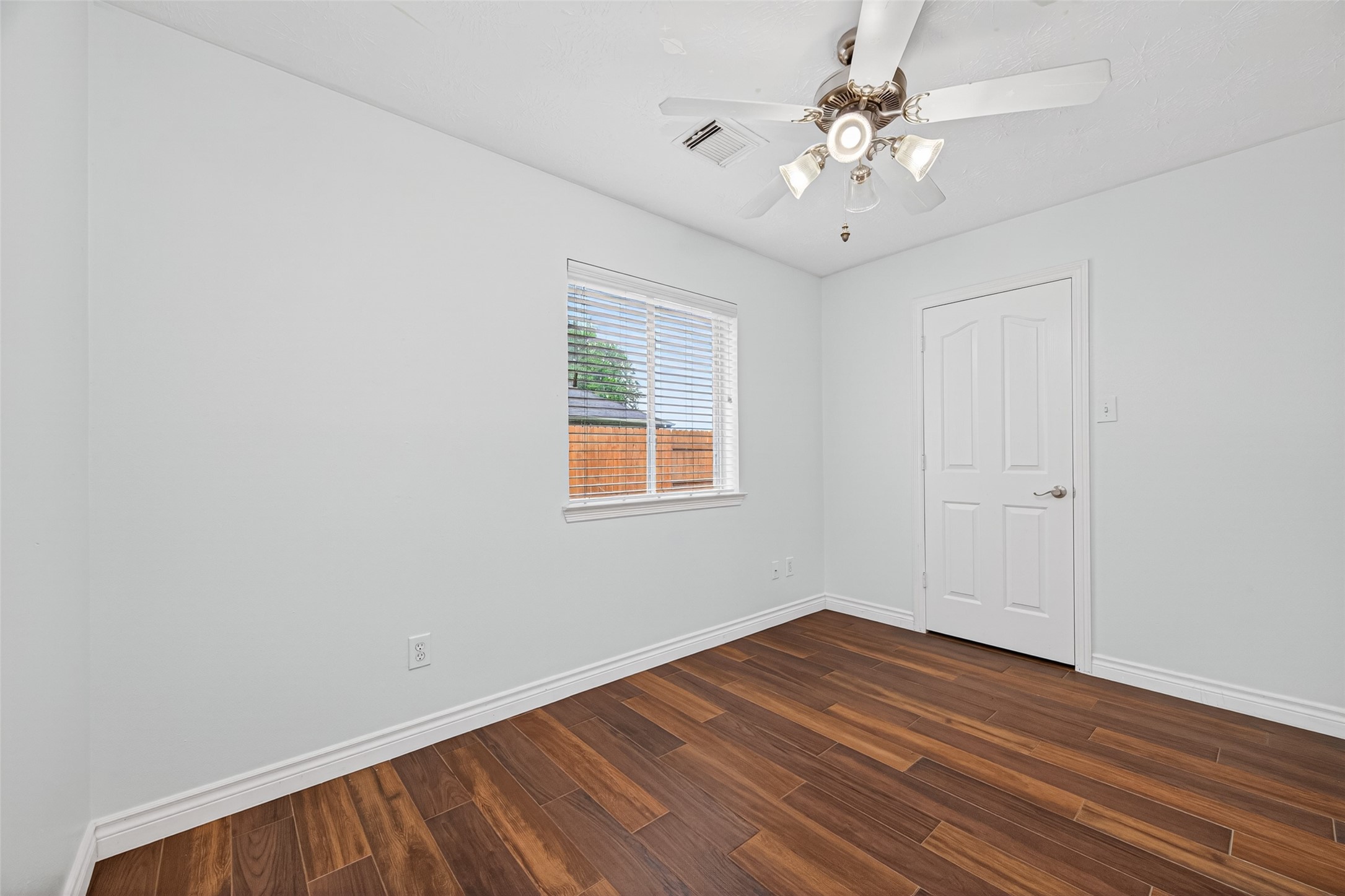 23914 Glengate Drive Spring, TX 77373 - Photo 29 of 49 wooden floor in an empty room with a window