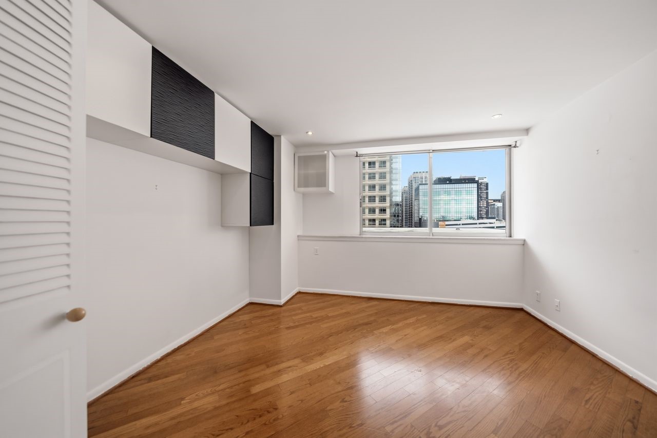 2016 Main Street, Unit 701 Houston, TX 77002 - Photo 11 of 43 a view of empty room with wooden floor and fan