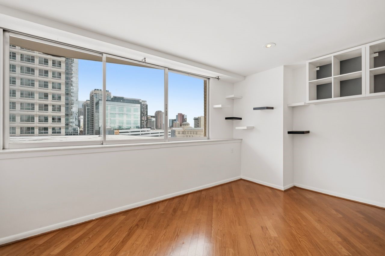 2016 Main Street, Unit 701 Houston, TX 77002 - Photo 14 of 43 a view of empty room with wooden floor and fan