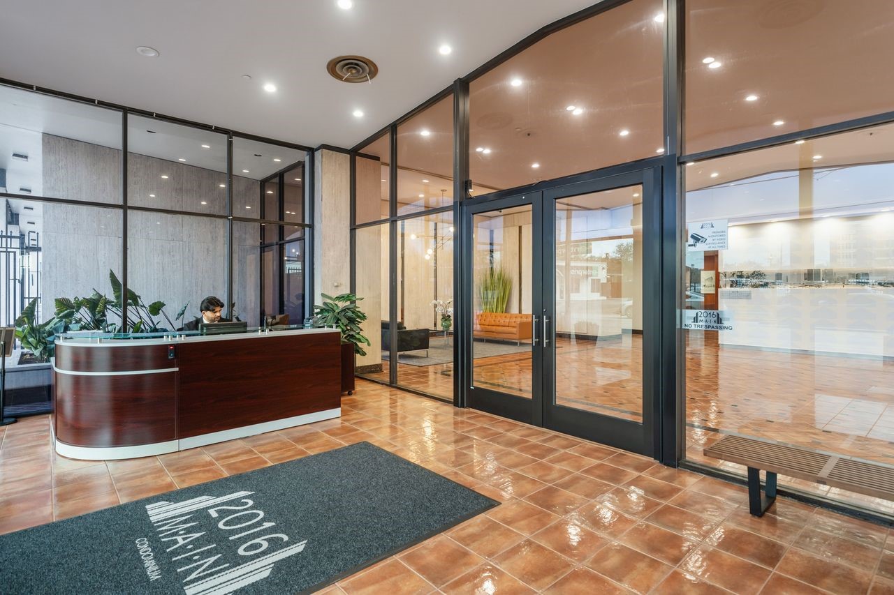 2016 Main Street, Unit 701 Houston, TX 77002 - Photo 19 of 43 a view of an empty room with wooden floor and windows