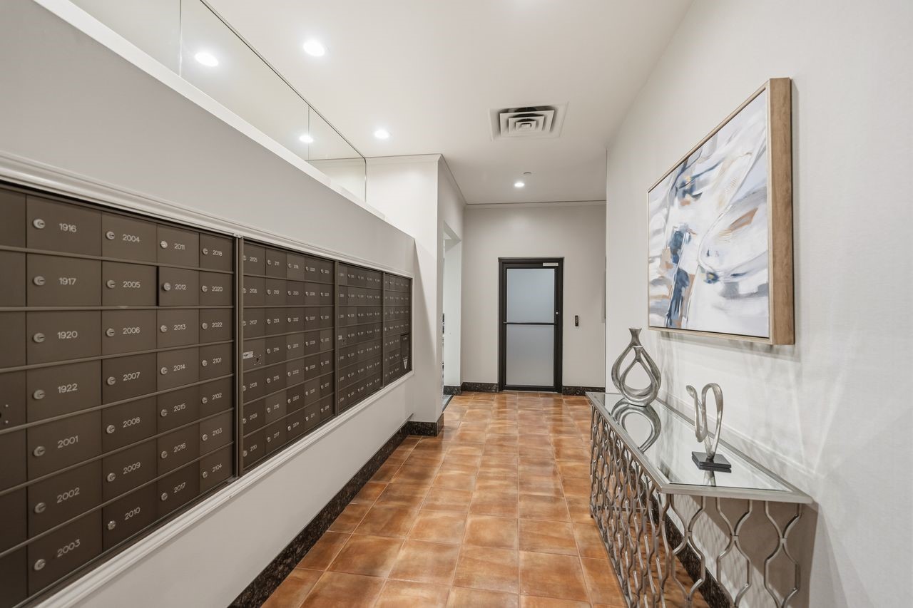 2016 Main Street, Unit 701 Houston, TX 77002 - Photo 22 of 43 a view of a hallway with wooden floor
