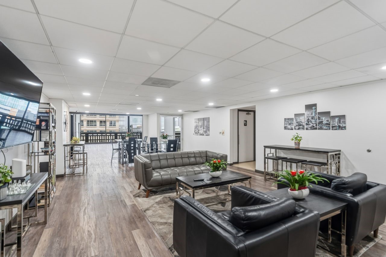 2016 Main Street, Unit 701 Houston, TX 77002 - Photo 24 of 43 a living room with furniture and a wooden floor