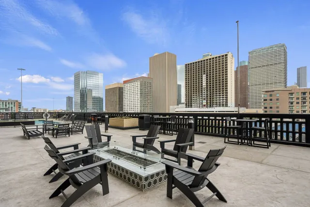 a view of a swimming pool with outdoor seating