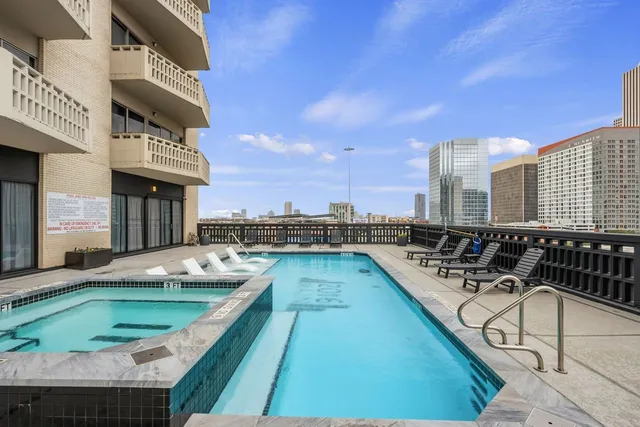 a view of a balcony with chairs