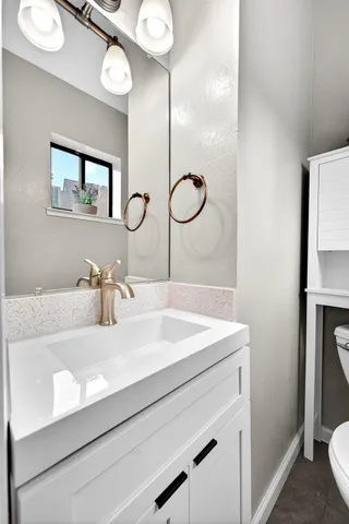 a bathroom with a sink and a mirror