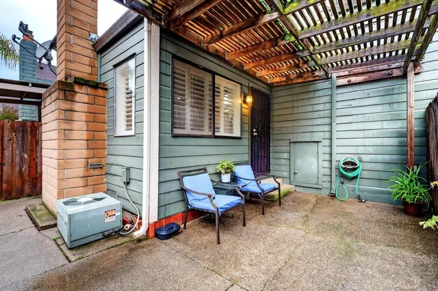 a outdoor space with patio furniture and potted plants