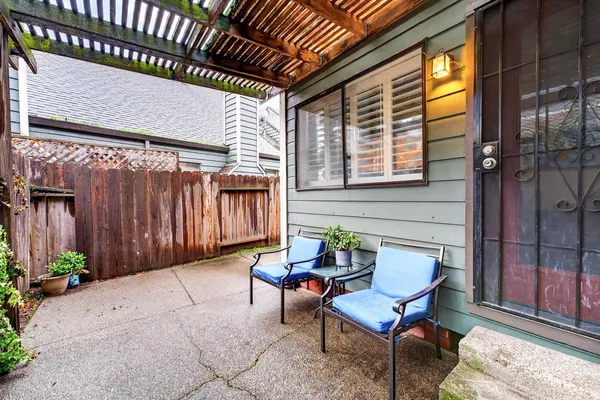 a view of a two chairs in the patio
