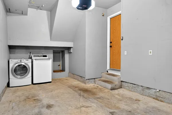 a view of a storage & utility room with washer and dryer