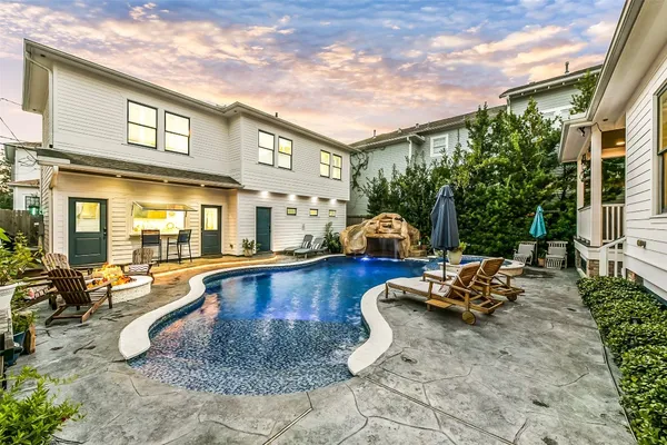 a view of swimming pool with a patio