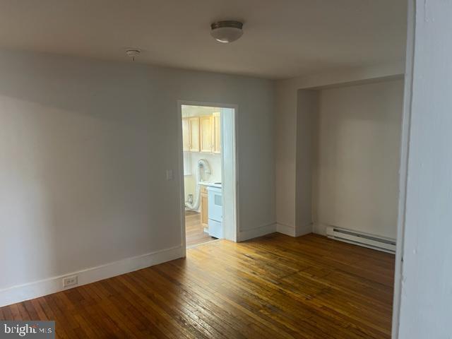 105 Cumberland Street, Unit 3 Clear Spring, MD 21722 - Photo 6 of 11 an empty room with wooden floor and closet