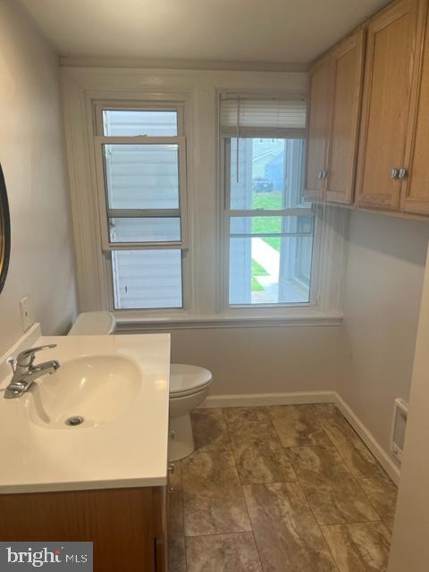 105 Cumberland Street, Unit 3 Clear Spring, MD 21722 - Photo 10 of 11 a bathroom with a sink toilet and window