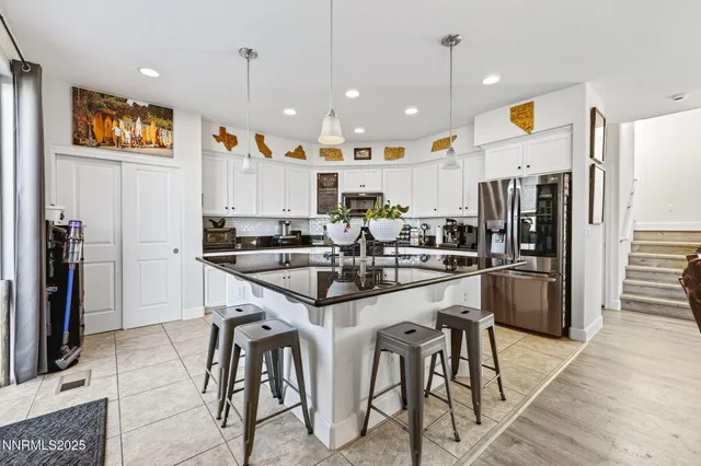 a living room with furniture and flat screen tv