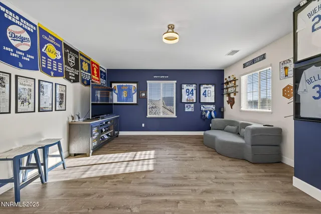 an aerial view of a city with lots of residential buildings and ocean view in back