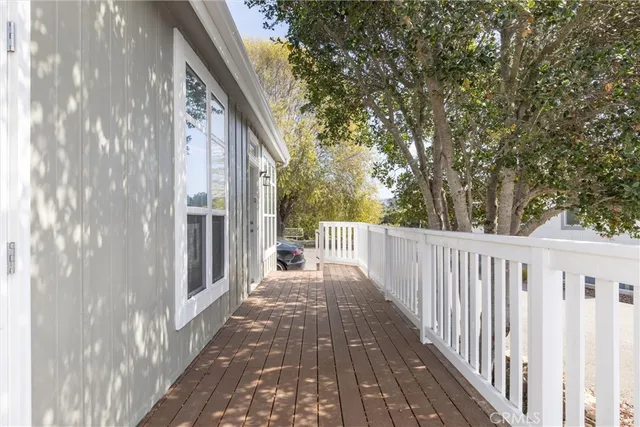 a view of a pathway of a house with wooden fence