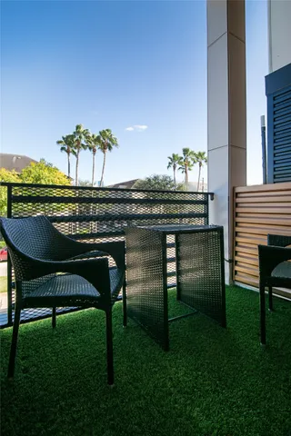 a view of a chairs and table in patio