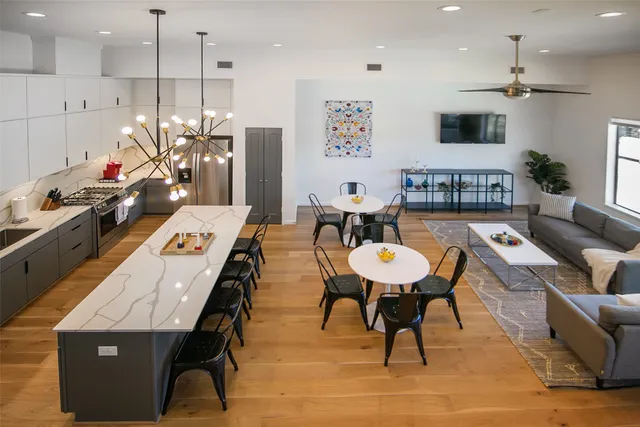 a living room with furniture and a table
