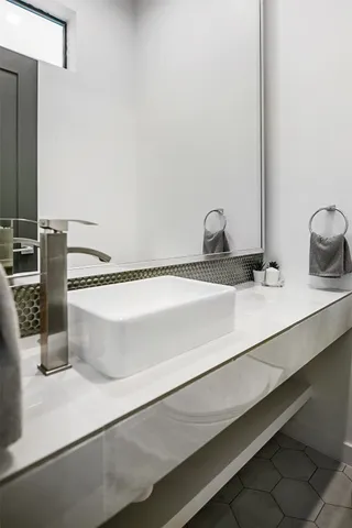 a close view of sink and a mirror