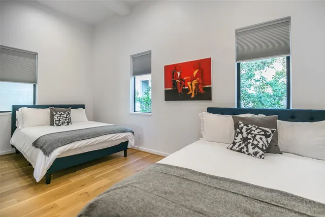 a bedroom with bed and a couch