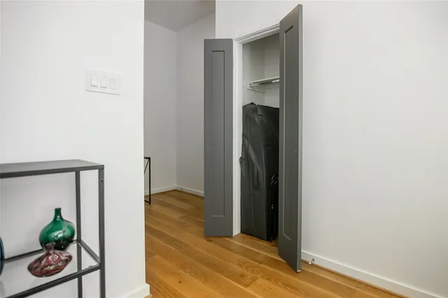 a view of entryway with wooden floor