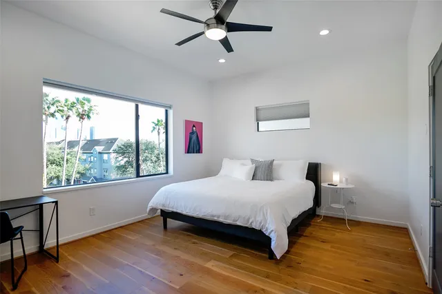 a bedroom with a bed and window