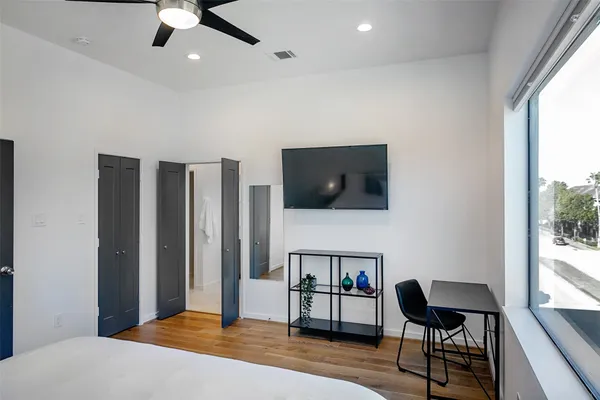a bedroom with furniture and window