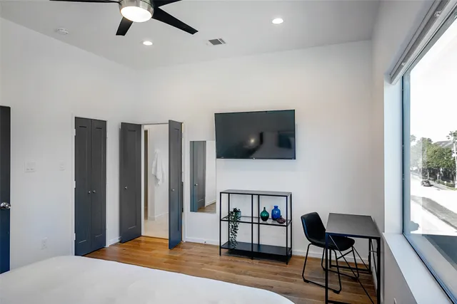 a bedroom with furniture and window