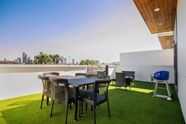 a view of an chairs and table in the patio