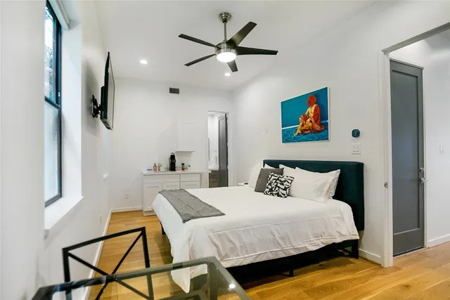 a bedroom with a bed and dresser