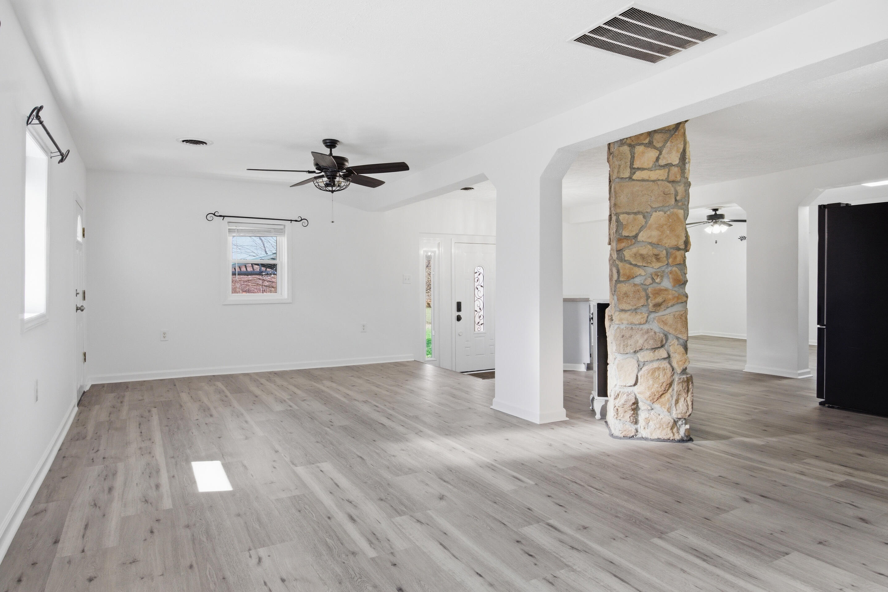 6458 Piney Woods Road Riner, VA 24149 - Photo 4 of 50 wooden floor in an empty room with a window