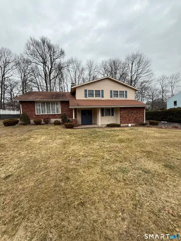 a front view of a building with garden